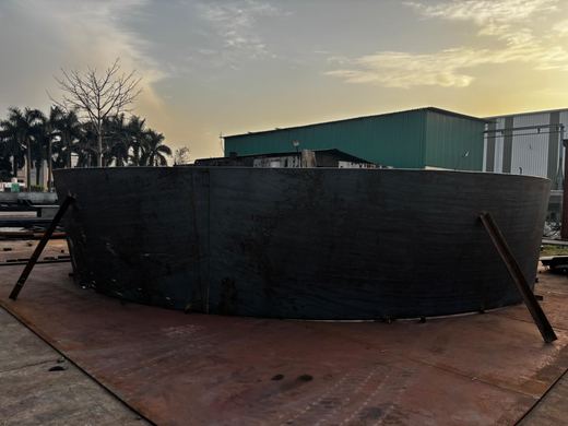Tunnel spillway liner — transition shell